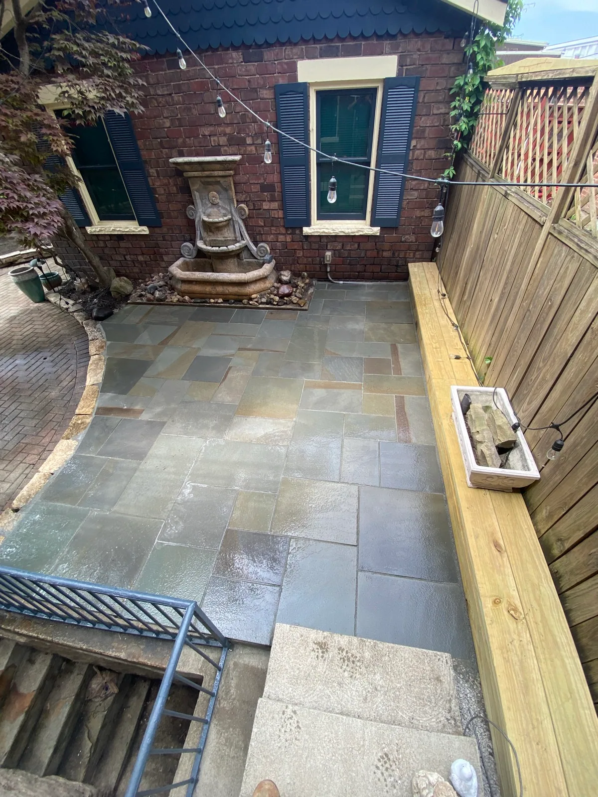 Stone courtyard patio completed by Queen City Hardscapes
